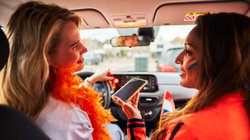 Friends in car wearing kingsday outfit