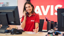 Avis female employee behind the counter