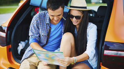 Two people in the back seat during summer